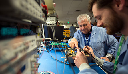 Mature engineer mentoring a young engineer