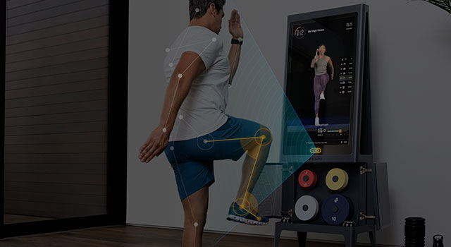 Tempo home gym tracking a man's motions as he works out.