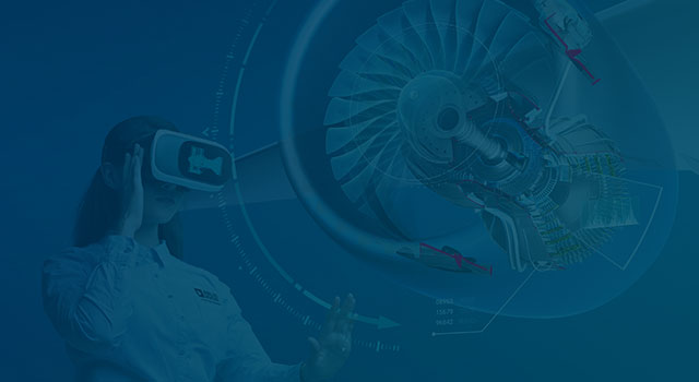 Young engineer uses virtual reality to rotate a turbine engine's digital twin.