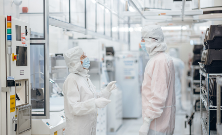 Two lab workers talking in the Limerick lab