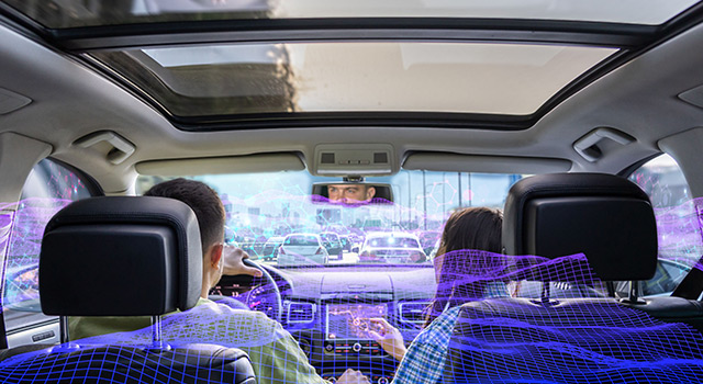 View from inside a car showing a driver and passenger surrounded by a digital visualization of sound waves