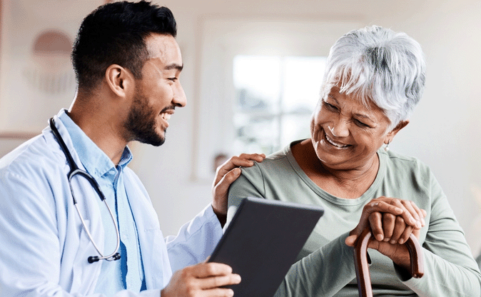 A Happy doctor providing good news to the patient