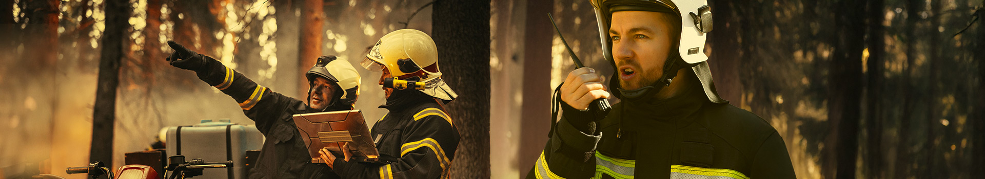 Firefighters in a forest wearing helmets and safety gear, coordinating efforts with a tablet and radio communication.