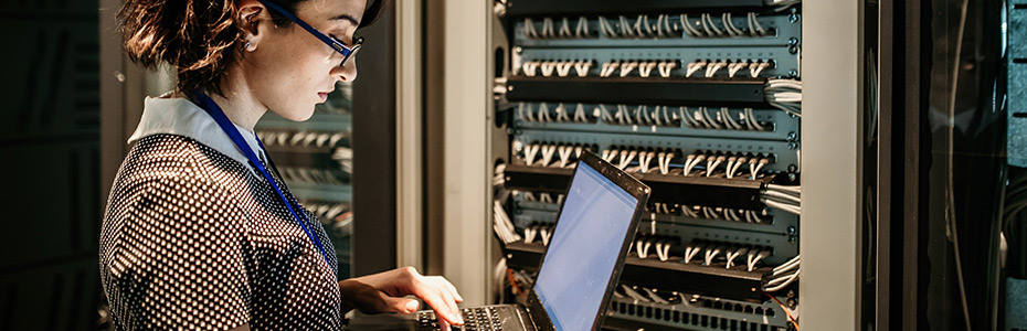 female IT engineer working in server room