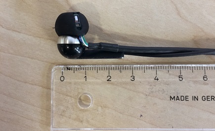 Test system with an integrated optical sensor and accelerometer with scale shown for comparison